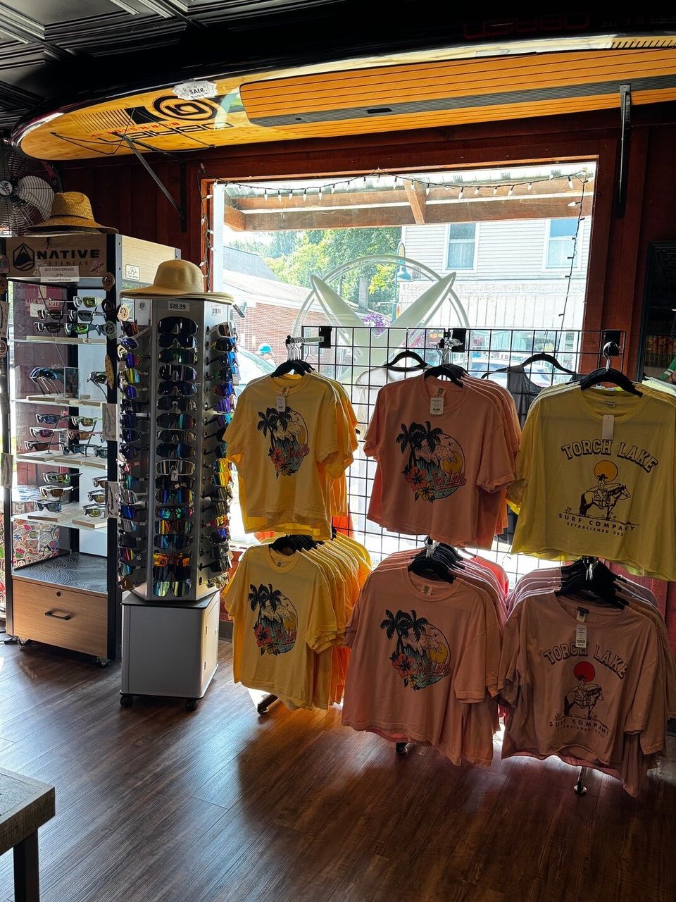 The Torch Lake Surf Co. shop floor, looking out the open front door